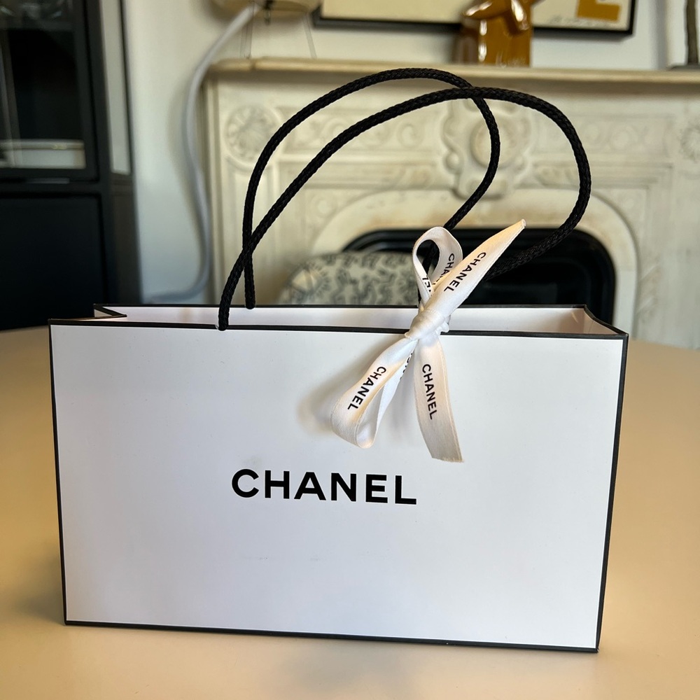 Empty white Chanel shopping bag